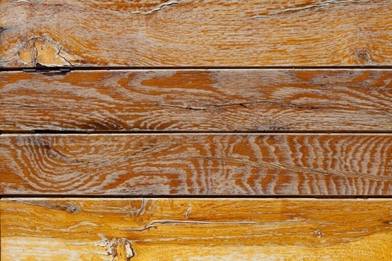 Um Close Acima De Uma Parede De Madeira Da Prancha QNN_IAewEc8