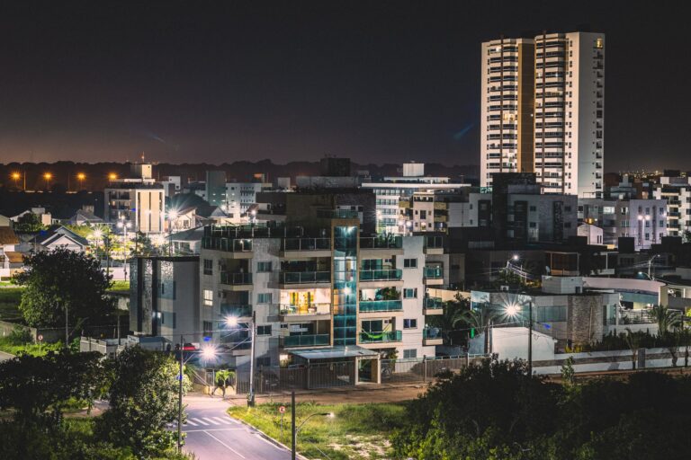 Explore the vibrant urban nightscape of João Pessoa, Brazil, illuminated under city lights.