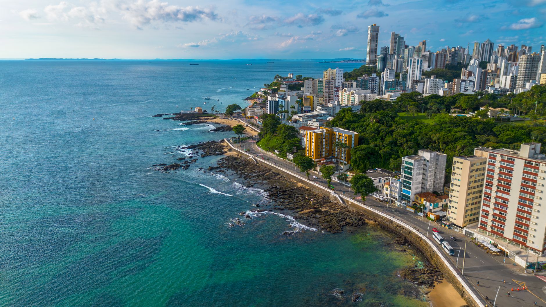 Stunning aerial view of a vibrant coastal cityscape in Porto Seguro, Brazil.
