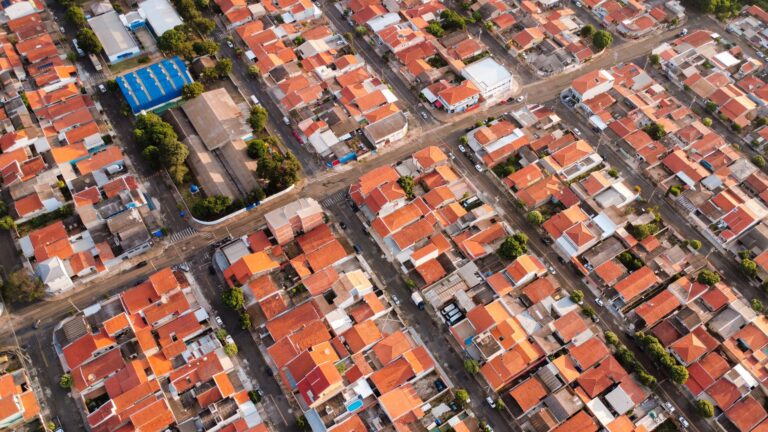 Aerial view showcasing the pattern of red-tiled rooftops in Hortolândia, São Paulo, Brazil.