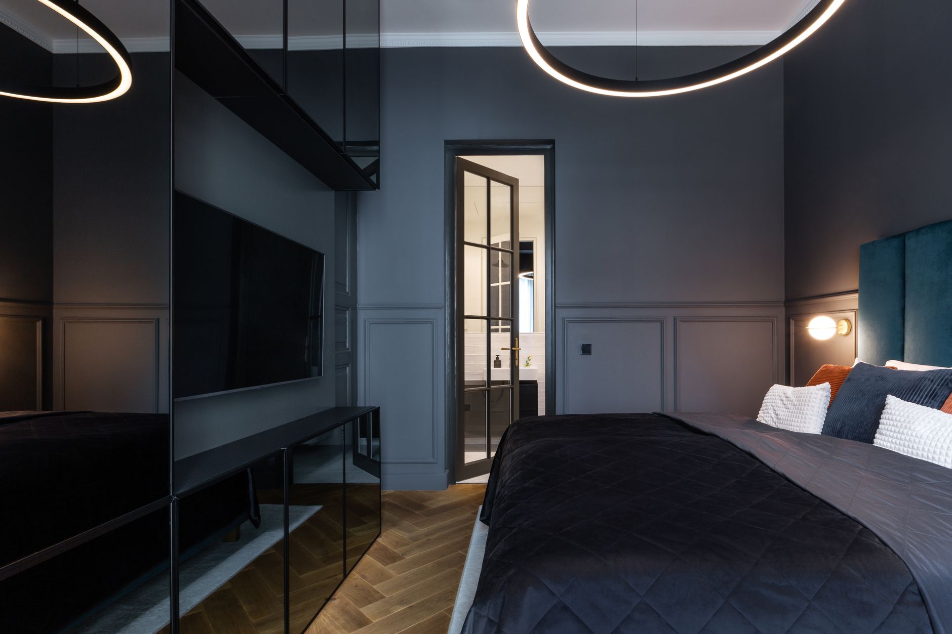 Elegant modern bedroom in Prague featuring chic decor and luxurious elements.