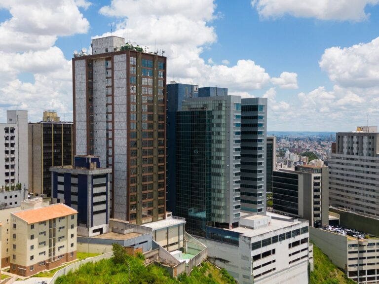 Cityscape of Belo Horizonte, Brazil featuring modern skyscrapers under a bright sky.