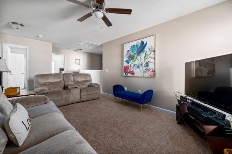 Inviting living room interior featuring plush seating and modern decor.