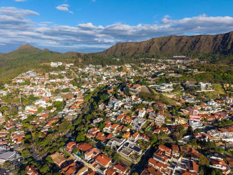 Aerial view showcasing the vibrant landscape of Belo Horizonte, Brazil with Serra do Curral mountains.
