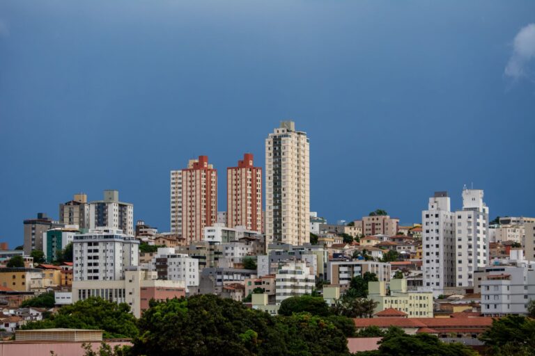 Modern skyline of Belo Horizonte with towering high-rise buildings under a clear blue sky.