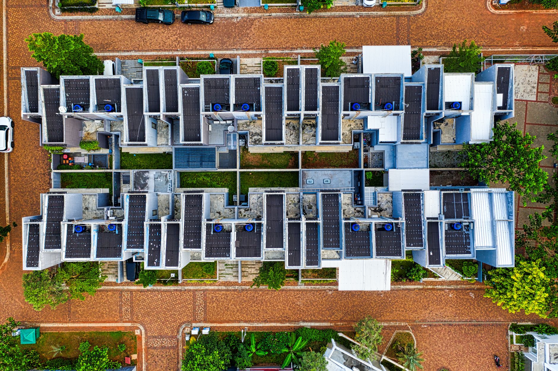 Drone shot of an organized residential area in Banten, Indonesia with solar panels.